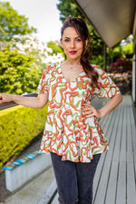 Load image into Gallery viewer, Abi Angel Sleeve Summer Top With Ruffle Hem In Green And Orange Print
