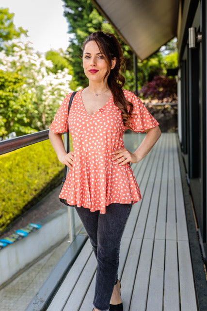 Dotty Angel Sleeve Summer Top With Ruffle Hem In Coral Spot Print