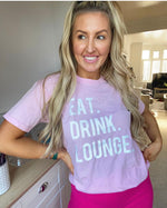 Load image into Gallery viewer, Eat Drink Lounge Slogan Tee In Pink With White Font
